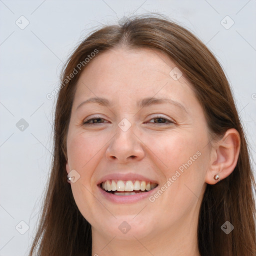 Joyful white young-adult female with long  brown hair and grey eyes