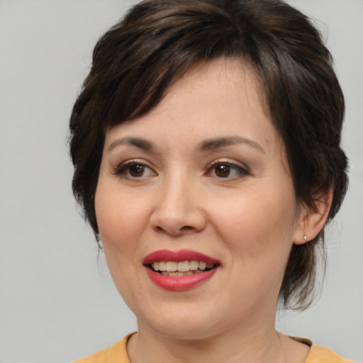 Joyful white young-adult female with medium  brown hair and brown eyes