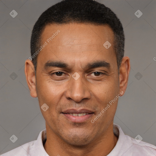 Joyful latino adult male with short  brown hair and brown eyes