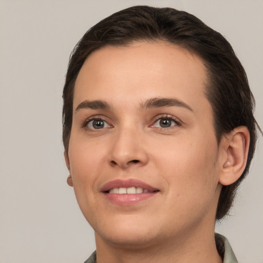 Joyful white young-adult female with short  brown hair and brown eyes