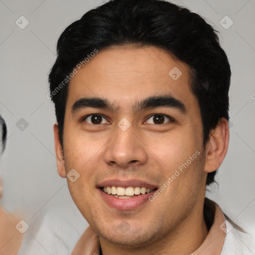 Joyful latino young-adult male with short  brown hair and brown eyes