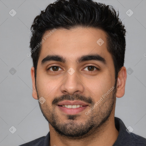 Joyful white young-adult male with short  black hair and brown eyes