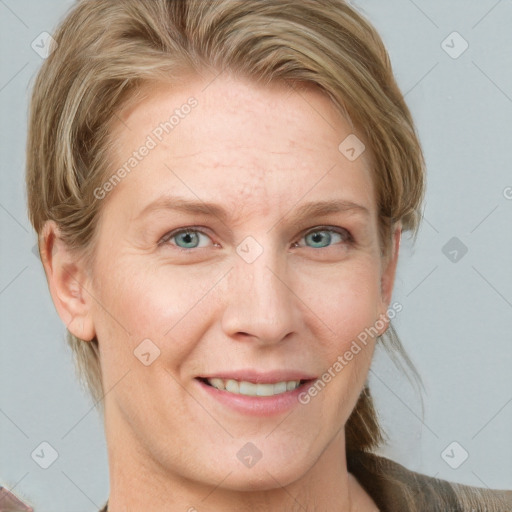 Joyful white adult female with medium  brown hair and blue eyes