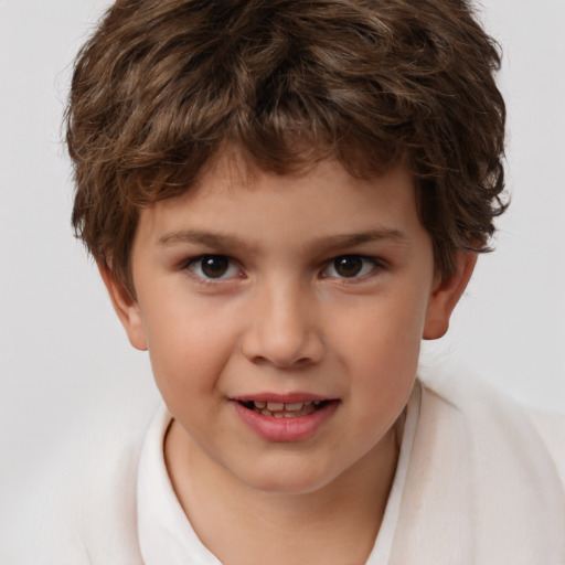 Joyful white child male with short  brown hair and brown eyes