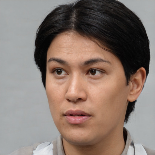 Neutral asian adult female with medium  black hair and brown eyes