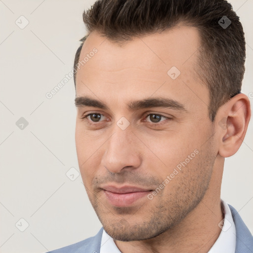 Joyful white young-adult male with short  brown hair and brown eyes