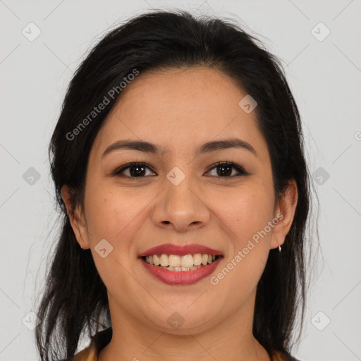 Joyful latino young-adult female with long  brown hair and brown eyes