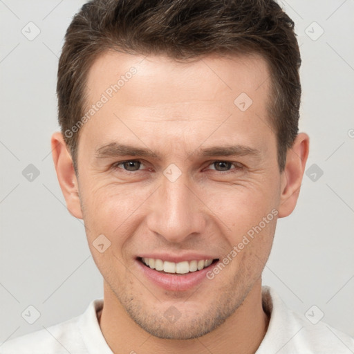 Joyful white adult male with short  brown hair and brown eyes