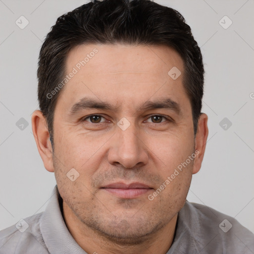 Joyful white adult male with short  brown hair and brown eyes