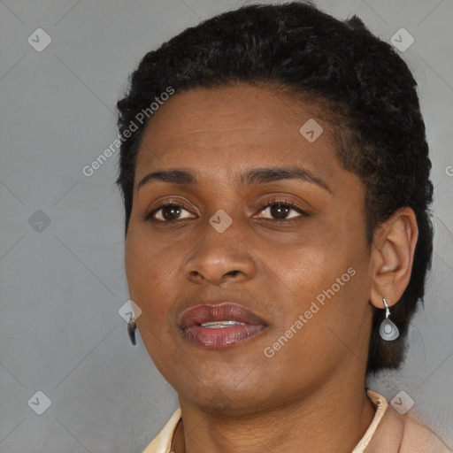 Joyful black young-adult female with short  black hair and brown eyes