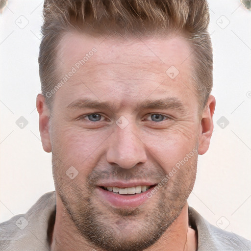 Joyful white adult male with short  brown hair and grey eyes