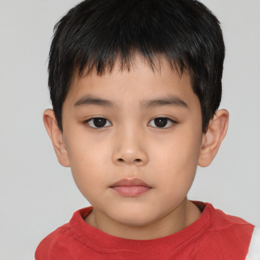 Neutral asian child male with short  brown hair and brown eyes
