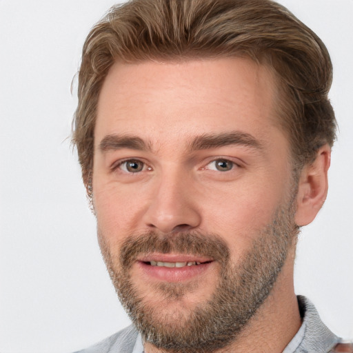 Joyful white adult male with short  brown hair and brown eyes