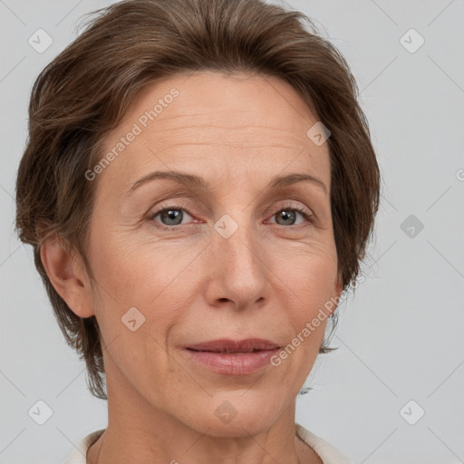 Joyful white adult female with short  brown hair and grey eyes