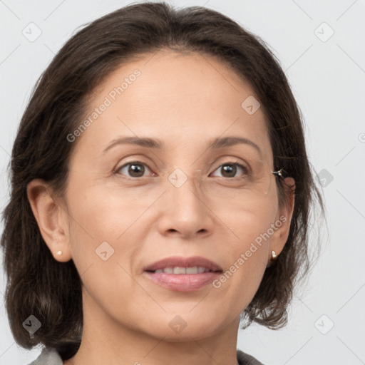 Joyful white adult female with medium  brown hair and grey eyes