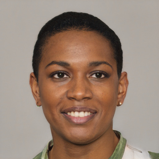 Joyful black young-adult female with short  black hair and brown eyes