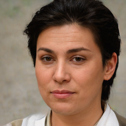 Joyful white adult female with short  brown hair and brown eyes