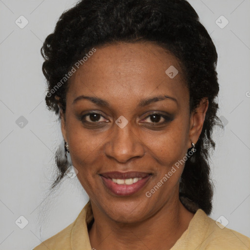 Joyful black adult female with medium  black hair and brown eyes