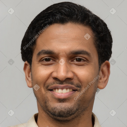 Joyful latino young-adult male with short  black hair and brown eyes