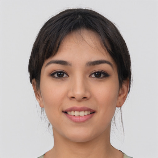 Joyful white young-adult female with medium  black hair and brown eyes