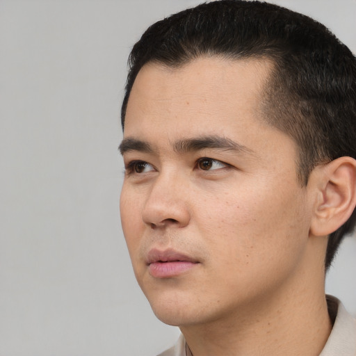 Neutral asian young-adult male with short  black hair and brown eyes