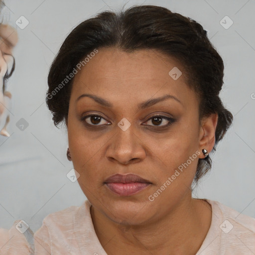 Joyful black adult female with medium  brown hair and brown eyes