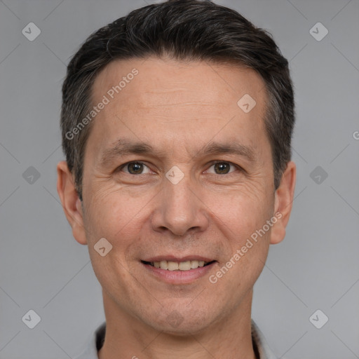 Joyful white adult male with short  brown hair and brown eyes