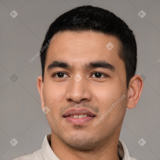 Joyful white young-adult male with short  black hair and brown eyes