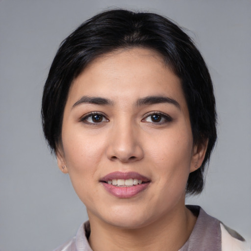 Joyful white young-adult female with medium  black hair and brown eyes