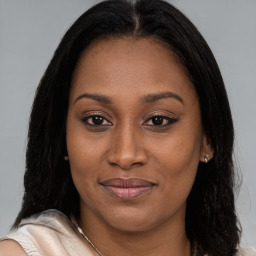 Joyful asian young-adult female with long  brown hair and brown eyes