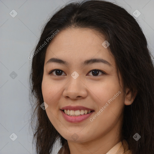 Joyful asian young-adult female with long  brown hair and brown eyes