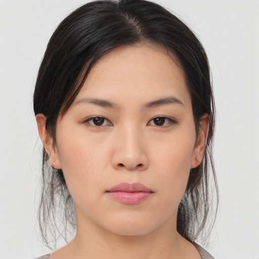 Neutral asian young-adult female with medium  brown hair and brown eyes