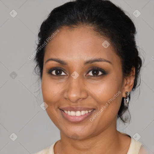 Joyful black young-adult female with medium  brown hair and brown eyes