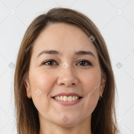 Joyful white young-adult female with long  brown hair and brown eyes