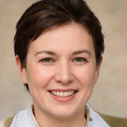 Joyful white adult female with medium  brown hair and brown eyes