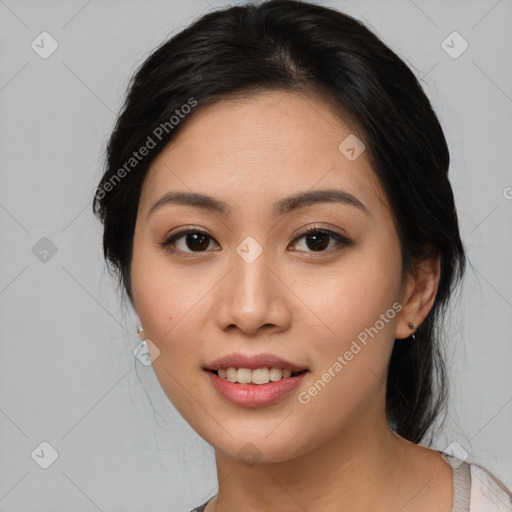 Joyful asian young-adult female with medium  black hair and brown eyes