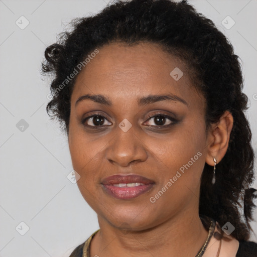 Joyful black young-adult female with short  brown hair and brown eyes