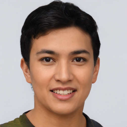 Joyful asian young-adult male with short  black hair and brown eyes