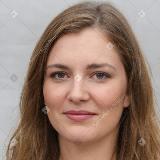 Joyful white young-adult female with long  brown hair and grey eyes