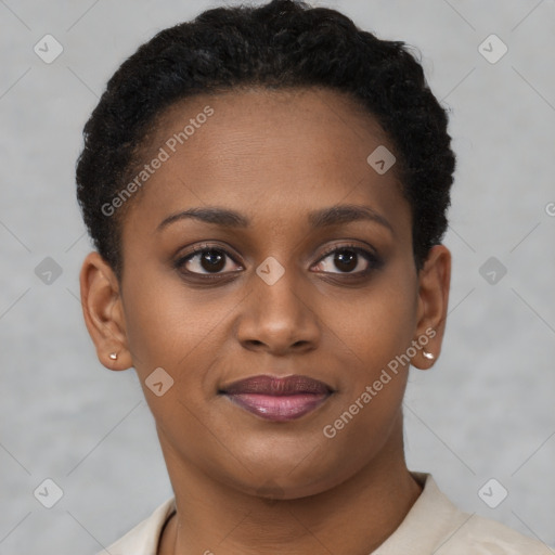 Joyful black young-adult female with short  brown hair and brown eyes