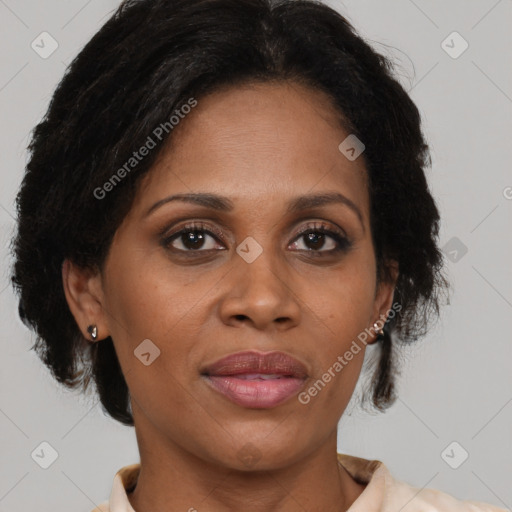 Joyful black adult female with medium  brown hair and brown eyes