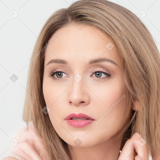 Neutral white young-adult female with long  brown hair and brown eyes