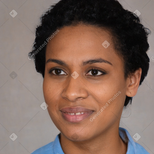 Joyful black young-adult female with short  black hair and brown eyes