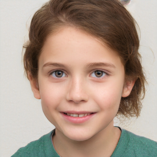 Joyful white child female with short  brown hair and grey eyes