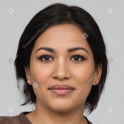 Joyful latino young-adult female with medium  brown hair and brown eyes