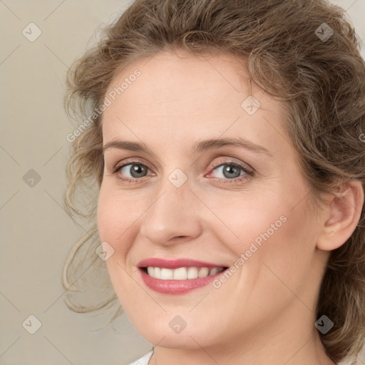 Joyful white young-adult female with medium  brown hair and green eyes