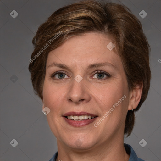 Joyful white adult female with medium  brown hair and grey eyes