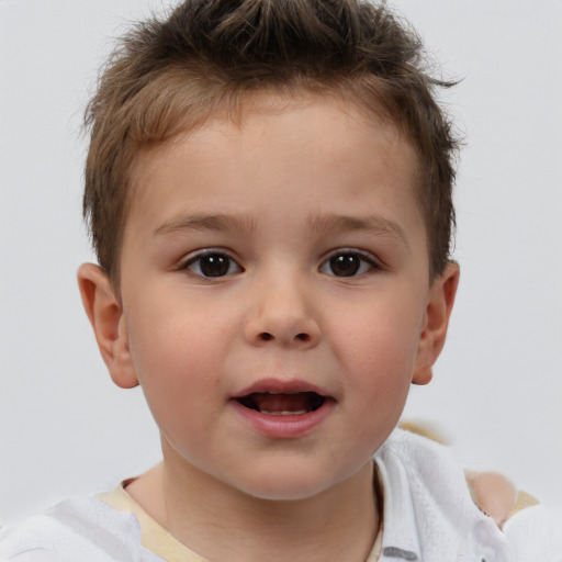 Joyful white child male with short  brown hair and brown eyes