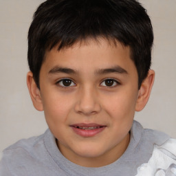 Joyful white child male with short  brown hair and brown eyes