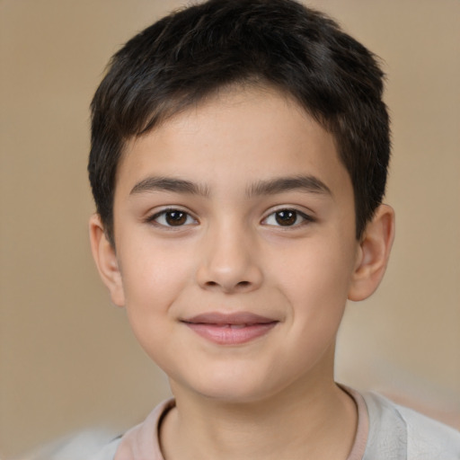 Joyful white child male with short  brown hair and brown eyes